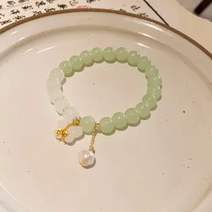 Close-up of New Chinese style beaded bracelet with butterfly and pearl charms