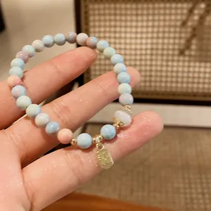 Handmade new Chinese style pastel beaded bracelet with a gold luck character pendant detail