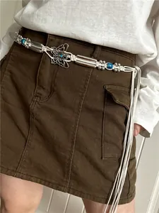 Detail view of a Bohemian woven waist chain featuring a butterfly pendant and beads