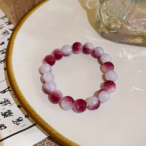 Detailed view of New Chinese style beaded bracelet with iridescent strawberry crystal beads