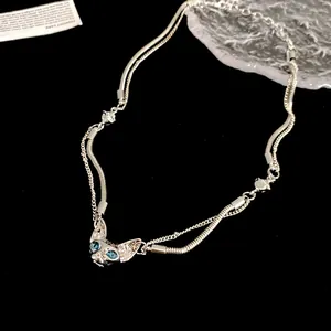 Detailed view of a cyberpunk cat head necklace featuring double-layered silver chains