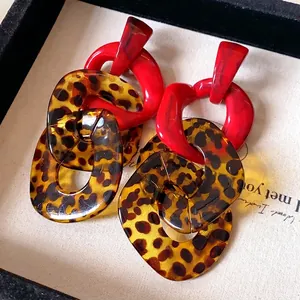 Statement leopard print chain dangle earrings with bold red links and silver needles