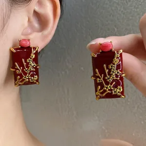 Elegant red enamel earrings with gold plum blossom and pink stone in New Chinese style