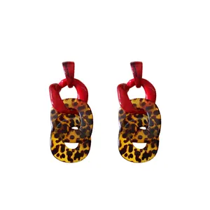 Vintage leopard print acrylic chain link dangling earrings with red circle accents