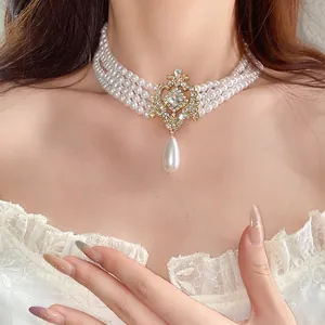 Vintage French court style four-layer pearl choker with crystal teardrop pendant detail
