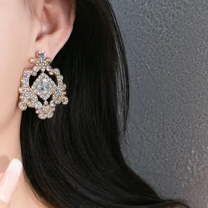 Detailed close-up showing vintage French court style rhinestone geometric stud earrings