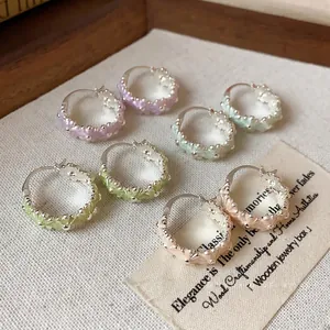 Pastel enamel flower drip oil hoop earrings set on a vintage aesthetic cream background