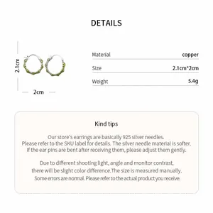 Macro detail view of enamel flower hoop earrings with size and material specifications