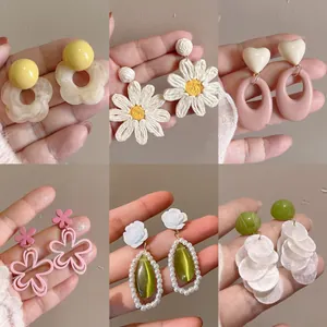 Collection of dopamine-style floral and geometric earrings in various colors and designs