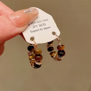 Premium gold-plated hoop earrings featuring natural tiger eye stone beads for women