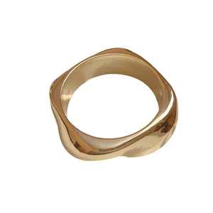 Chunky gold geometric acrylic bangle with irregular faceted design for women
