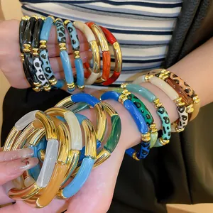 Chunky acrylic leopard print and solid color bracelets with gold-tone accents for women