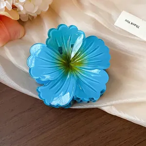 Large blue pleated flower hair claw clip with glossy finish for thick hair