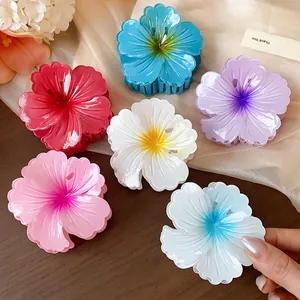 Detail showing colorful flower-shaped shark hair clips with textured striped petals