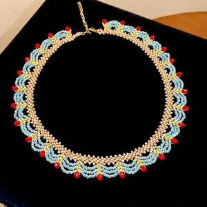 Handmade ethnic style glass beaded lace necklace with vibrant red and blue accents