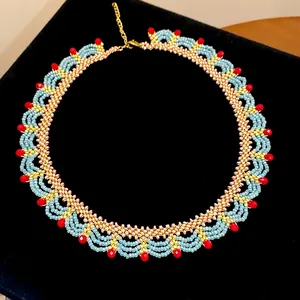 Ethnic style handmade blue and gold glass beaded lace necklace with red accents