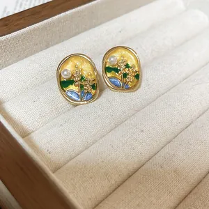 Exquisite oval enamel earrings with landscape design and pearl accent in jewelry box