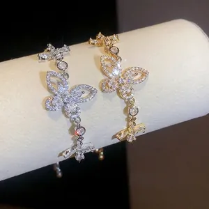 Elegant French style butterfly bracelets with sparkling zirconia in gold and silver.
