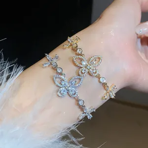 Elegant close-up of sparkling zircon butterfly bracelets in gold and silver finish