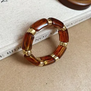 Bracelet élégant en acrylique écaille de tortue ambre avec séparateurs dorés femme (87 chars)