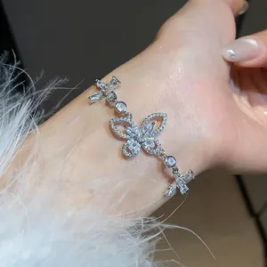 Macro view of a delicate silver-colored butterfly bracelet with sparkling zircons