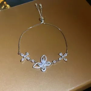 Elegant zircon butterfly bracelet with adjustable sliding clasp design.