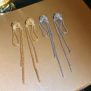 Elegant vintage gold and silver metal chain knot tassel earrings in high-end luxury style