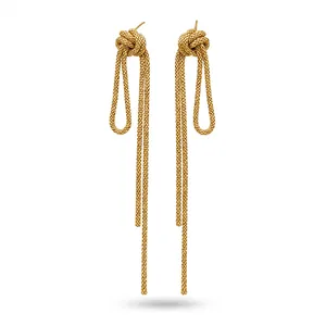 Elegant vintage gold knot tassel drop earrings with textured long chain fringe detail