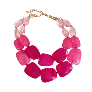 Chic double-layer statement necklace featuring irregular pink acrylic beads on gold chain