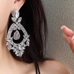 Ornate floral teardrop earrings with shimmering crystals in a luxury palace style