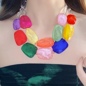 Detail view of a vibrant double-layer necklace with irregular colorful acrylic beads.