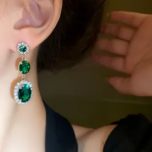 Vintage palace style silver needle oval emerald drop earrings with clear rhinestones
