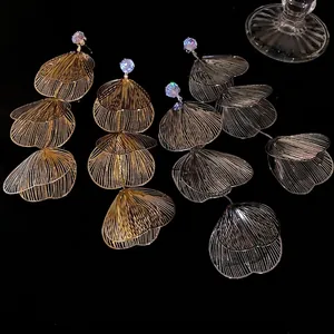 Glamorous gold and silver triple flower petal drop earrings with rhinestone accents