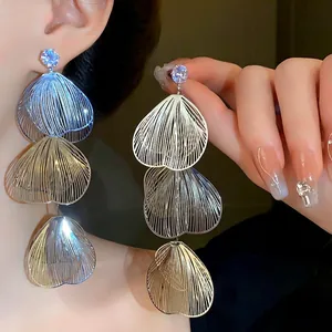 Exaggerated silver rhinestone flower tassel drop earrings with layered filigree petal design
