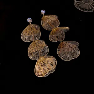 Elegant gold-tone layered flower petal tassel earrings with sparkling rhinestones