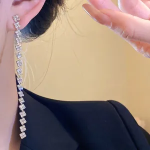 Elegant silver needle dangling earrings with sparkling square rhinestones and tassel design
