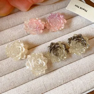 Elegant resin flower stud earrings with silver needles in pink and white colors