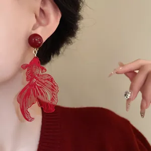 Detailed view of red hollow goldfish clip-on earring in elegant New Chinese Style