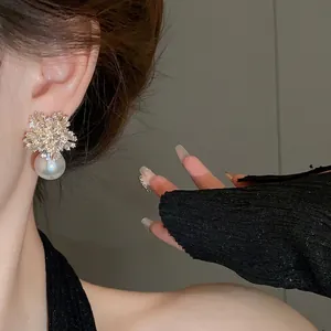 Elegant silver needle flower earrings with sparkling rhinestones and pearl drops