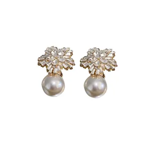 Elegant gold-tone flower rhinestone stud earrings with large drop pearls for women
