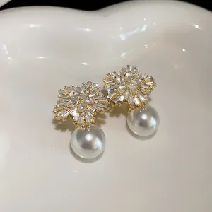 Elegant French style flower pearl earrings with sparkling rhinestones on white heart tray