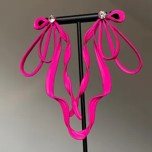Stylish neon pink ribbon bow earrings with sparkling rhinestones, Korean fashion design