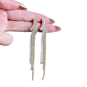 Elegant S925 silver needle tassel earrings with shimmering cubic zirconia geometric design.