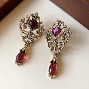 Vintage style hollow heart earrings with purple water drop pendants and rhinestones