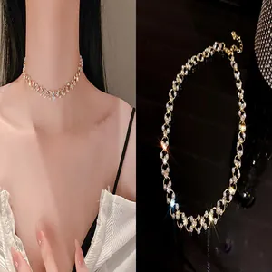 Close-up view of elegant pearl and rhinestone choker necklace with sparkling crystals