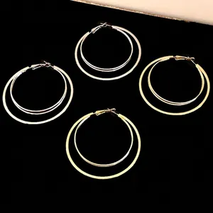 Elegant multi-layered double hoop earrings with a gold finish for women's fashion.