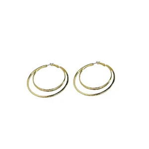 Fashionable gold double layered hoop earrings featuring minimalist steel pins for women