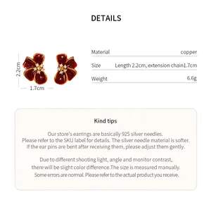Detail view of red zircon flower stud earrings with dimensions and copper material specs