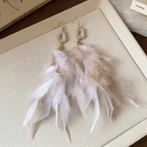 Elegant feather tassel earrings with translucent stone hooks for a refined luxury look