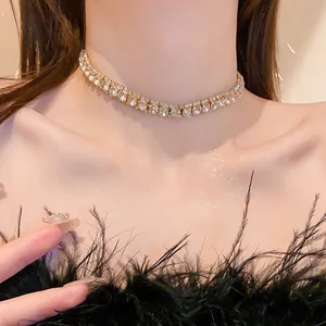 Detailed view of luxury gold-toned rhinestone choker necklace with square sparkling stones